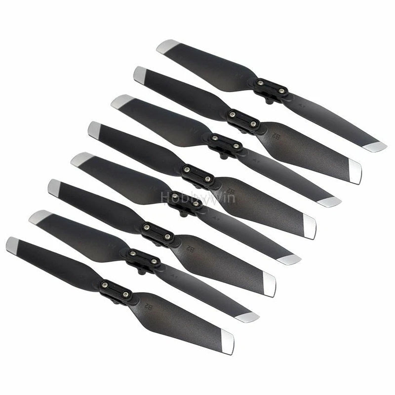 8-piece black quadcopter propeller blade set with mounting hubs and silver tips