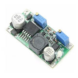 LM2596 DC-DC buck converter module PCB with blue inductors and electrolytic capacitors