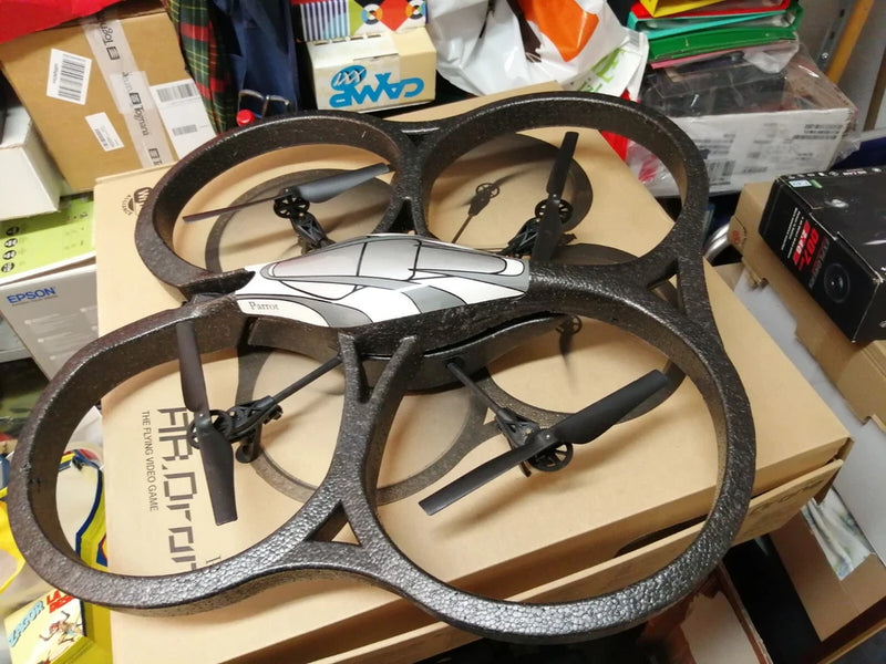 Parrot AR.Drone quadcopter with four black propellers, body and landing frame