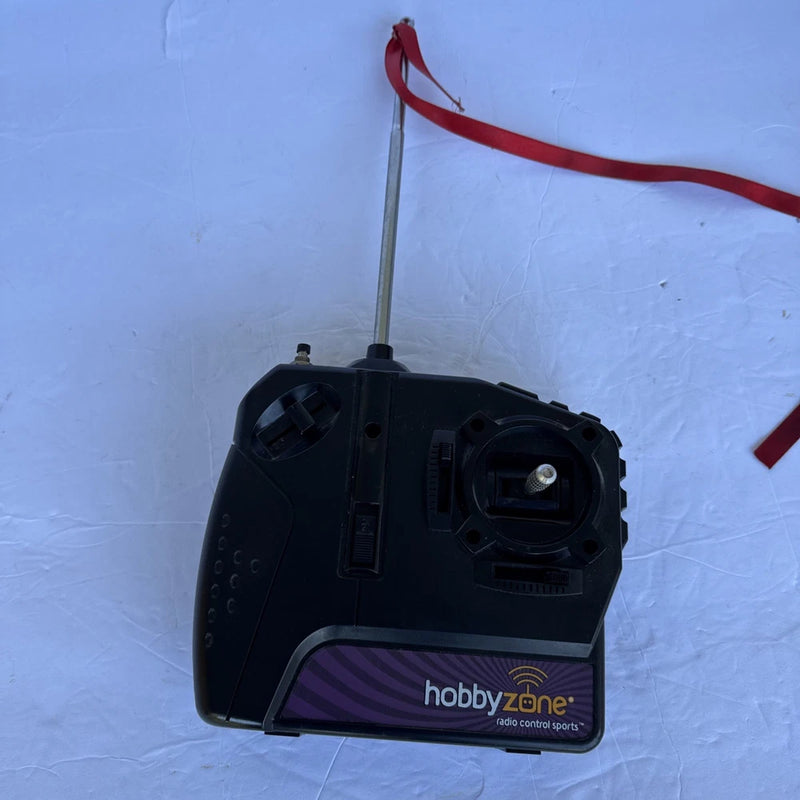 Black handheld remote control transmitter with antenna and HobbyZone logo