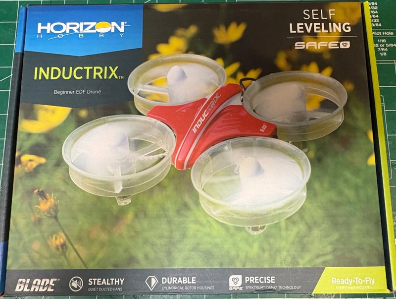 Blade Inductrix ultra micro drone box with red quadcopter and four white propellers