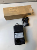 X-CITER 12V battery charger with power cord and plug, black housing
