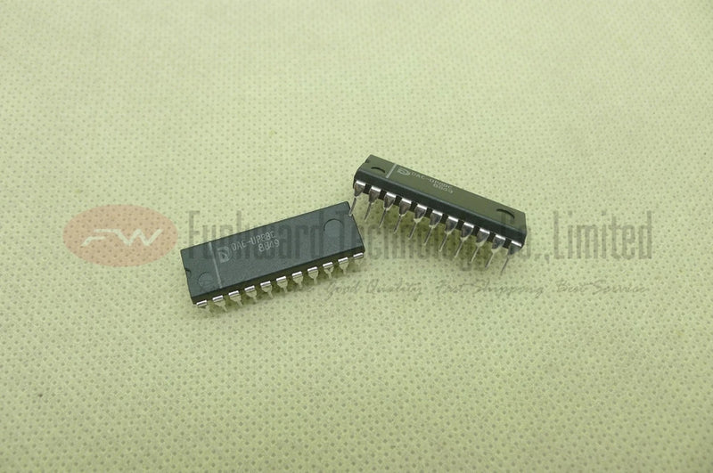 8-bit D/A converter ICs in DIP-22 packages, two black pin chips