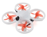 Indoor FPV quadcopter drone with white frame, four orange propellers, front camera