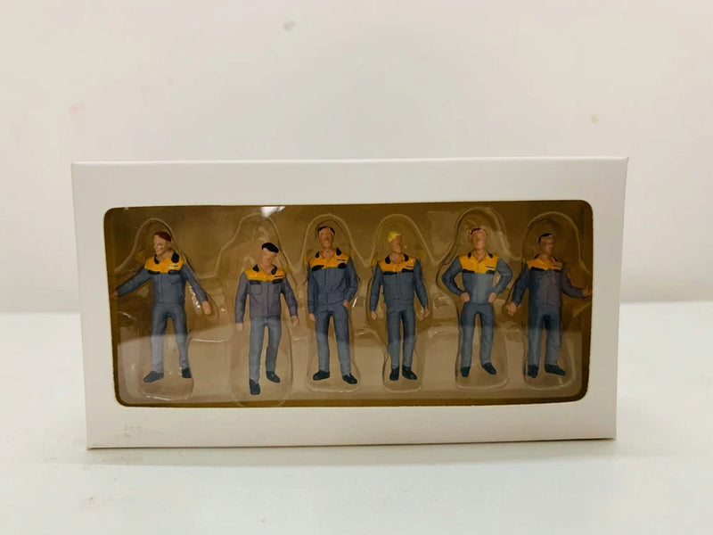 Set of six model worker figures in blue overalls inside a blister-style box