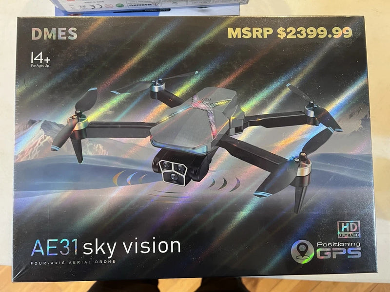 Four-axis aerial drone with HD camera and GPS, shown on retail box