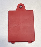 Red plastic battery cover with attached screw