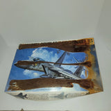 Open box 1:48 F-15C Eagle model aircraft kit with blue plane artwork
