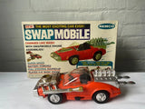 Battery-powered vintage model car, orange and red Remco Swapmobile with open hood