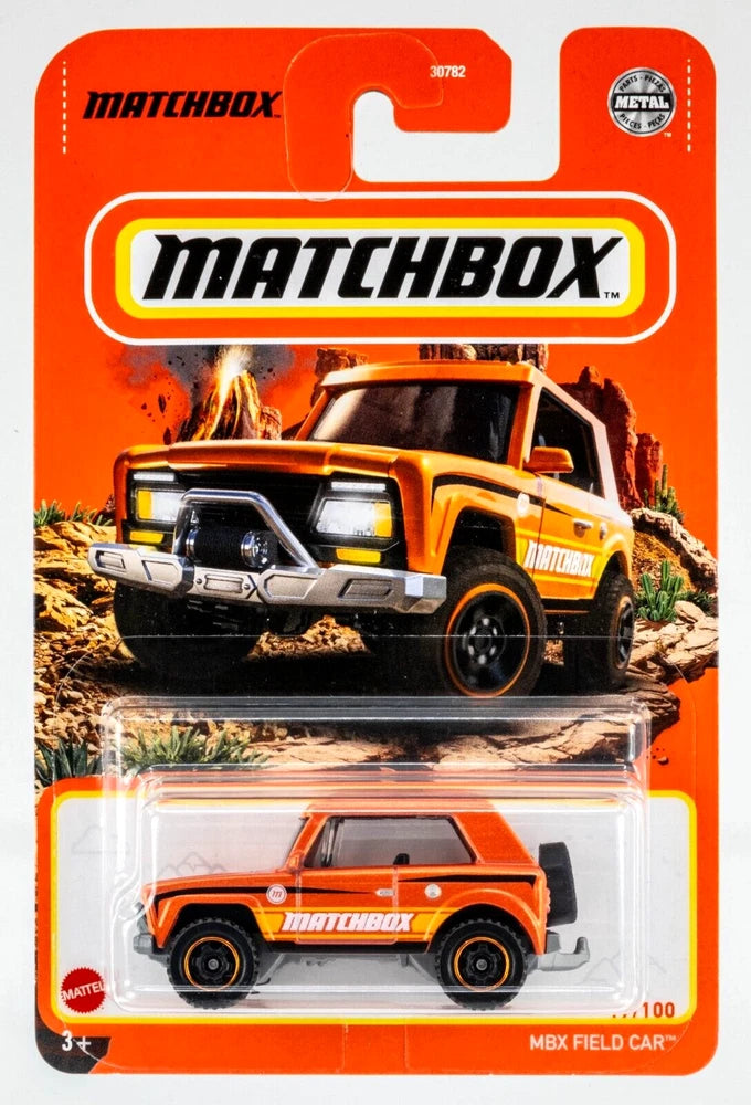 Orange Matchbox metal field car toy in blister package, pickup style, die-cast truck