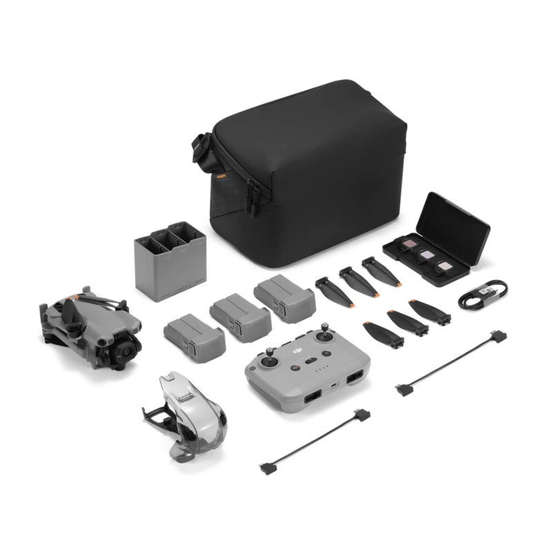 Drone kit with controller, multiple batteries, accessories, and carrying case