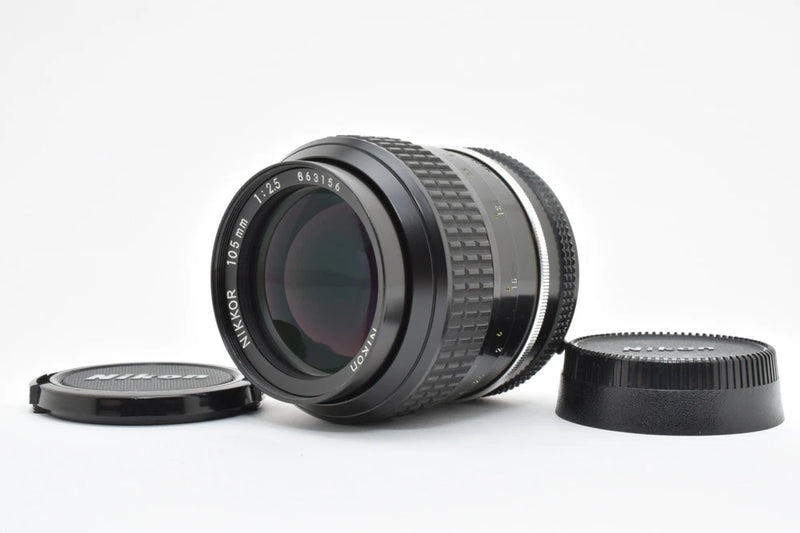 Black Nikon Ai Nikkor 105mm f/2.5 manual telephoto lens with front and rear caps