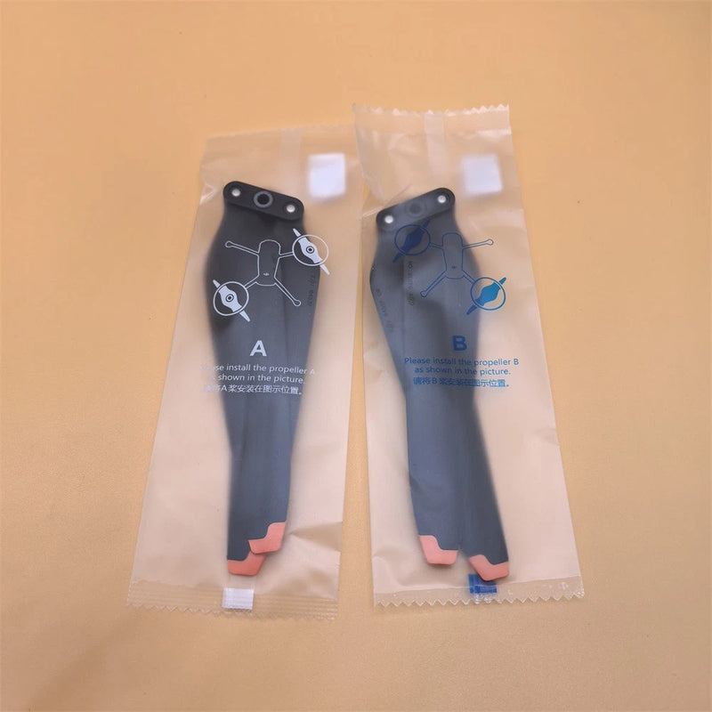 DJI Mavic 3 drone paddle replacement parts, two dark blue components in pouches