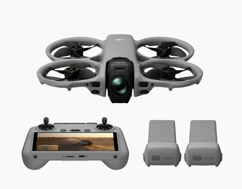 FPV drone with RC controller and two spare batteries, gray quadcopter design