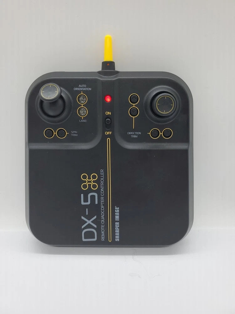 Dark gray drone video controller with antenna, thumbsticks, and labeled DX-5 front