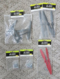 Blade 350 QX quadcopter parts lot with prop blades, landing gear, and hardware in bags