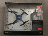 Navy blue RC quadcopter with onboard camera shown in retail product box packaging