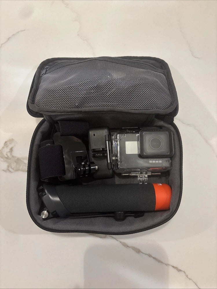 GoPro HERO7 action camera in zippered case with mounted accessories, black