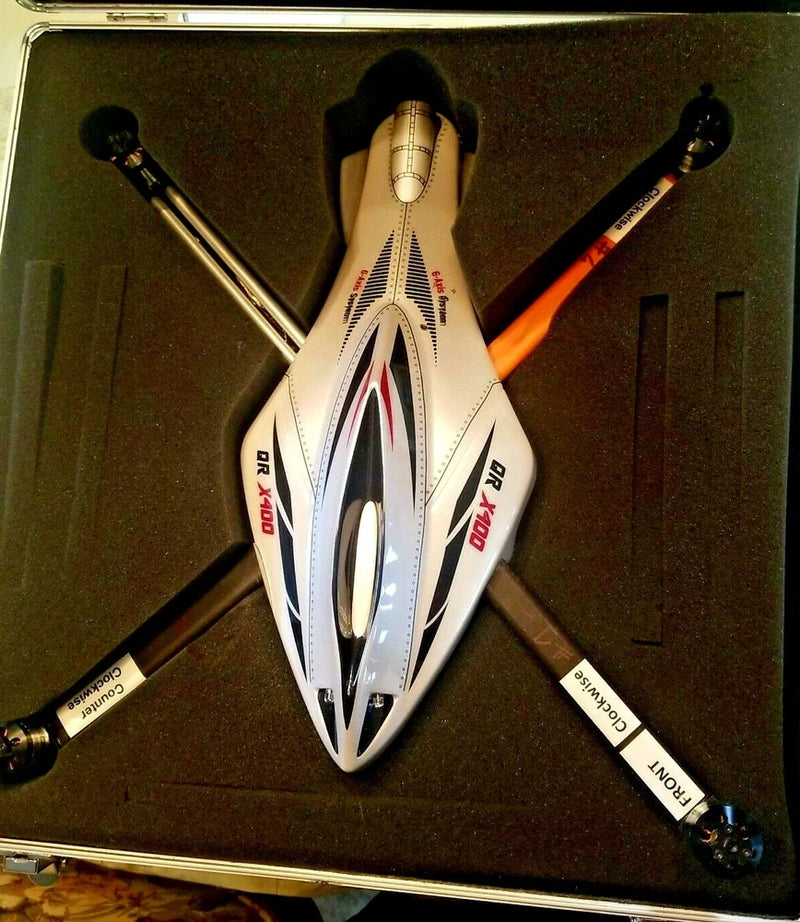 White Walkera X400 quadcopter drone with four black propellers and orange accents
