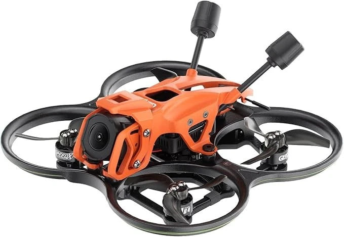 Orange and black cinewhoop FPV drone with camera, four propellers, and antenna