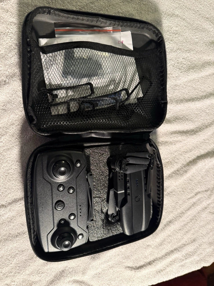 RC drone kit with camera stored in a black zippered carrying case