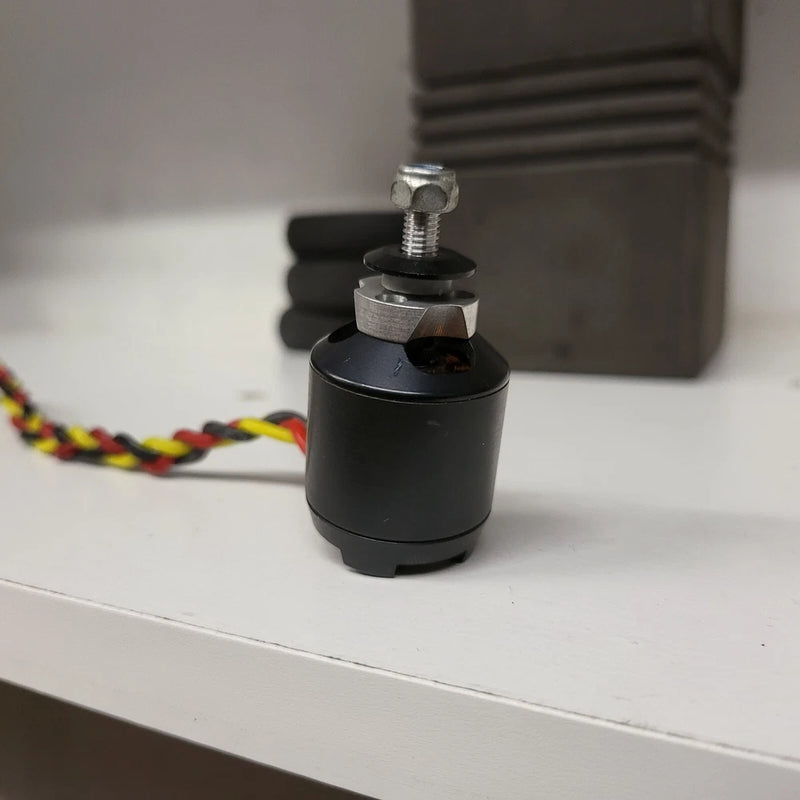 Droidworx AXI 2217/20 840kv drone motor, custom black cylindrical housing with mounting bolt