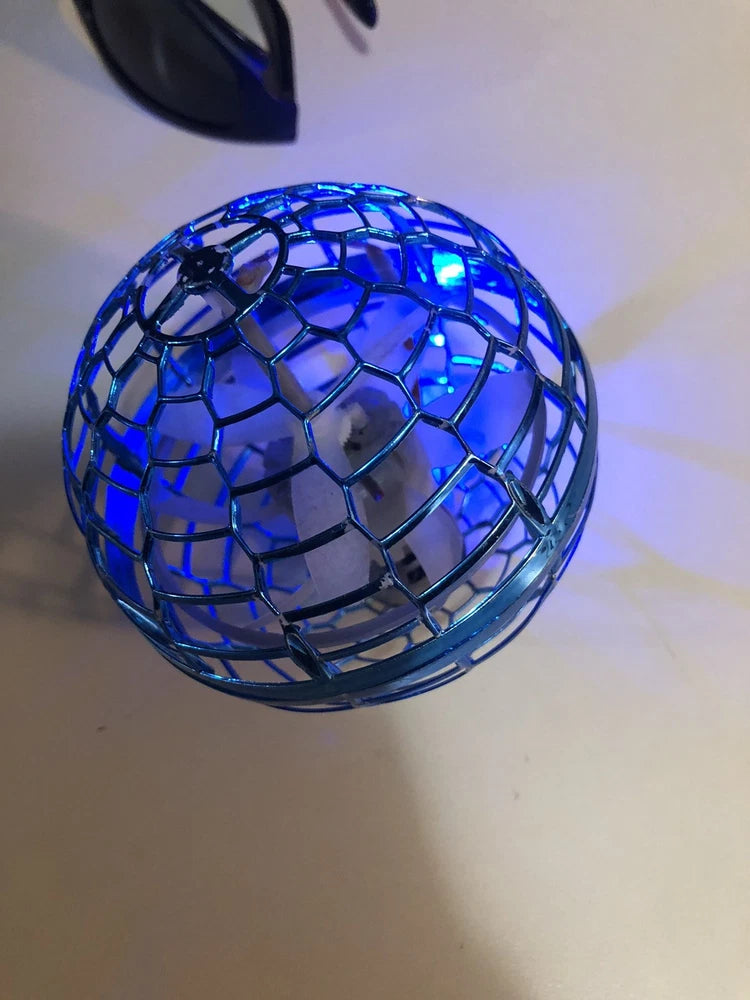 Blue spherical aerial drone with glowing LED lights and mesh cage