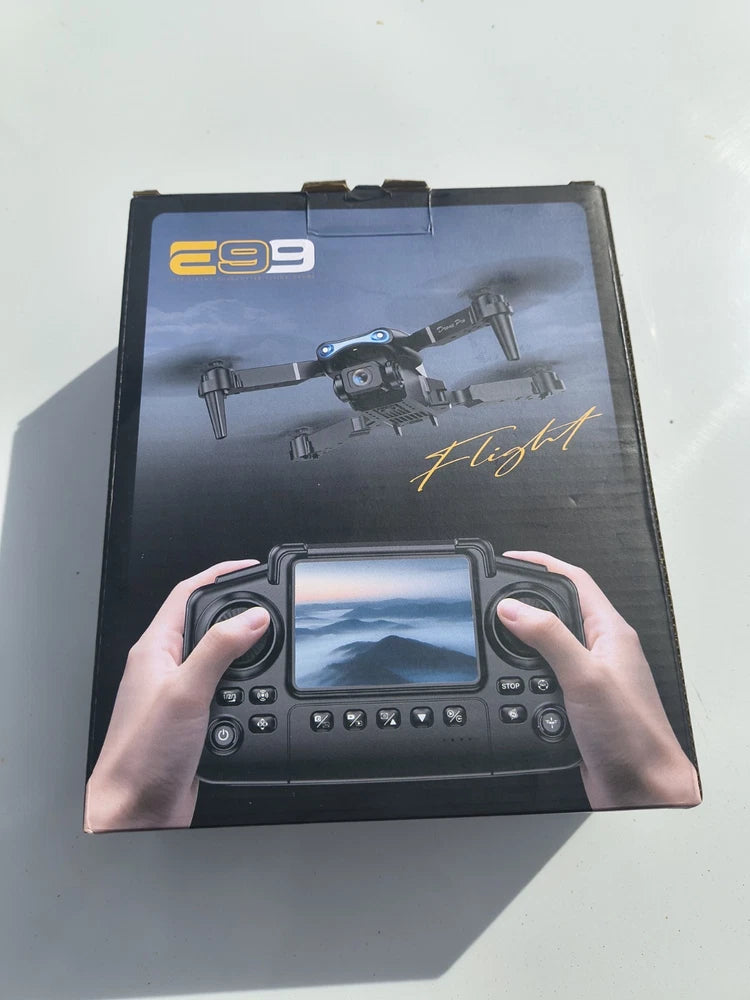 Quadcopter drone kit box with printed controller and drone images