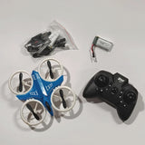 Blue mini quadcopter drone with four propellers and black 4-channel remote controller