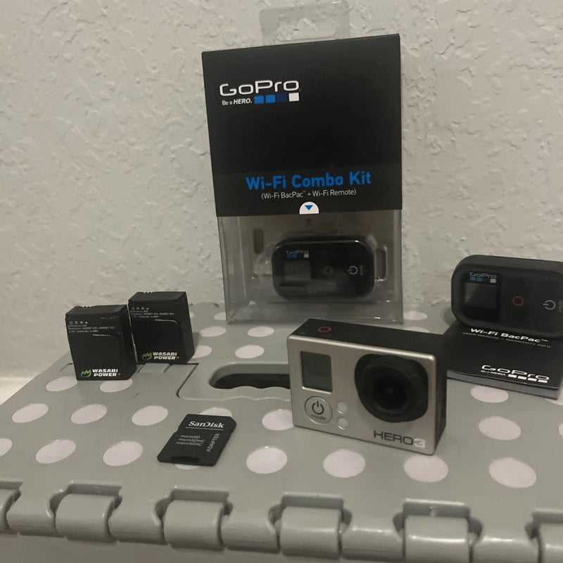 GoPro action camera bundle with Wi‑Fi remote, battery packs, and mounts