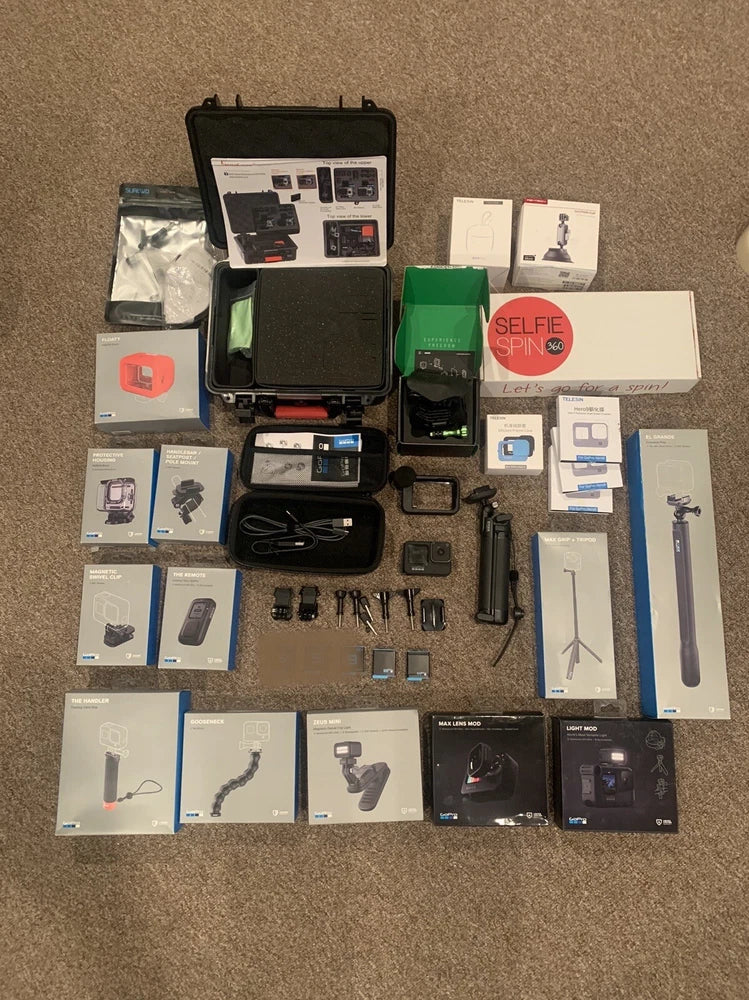 GoPro HERO9 Black action camera accessories bundle with camera, mounts, and boxes