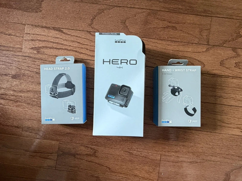 Action camera accessory bundle retail boxes: Hero 4K, head strap 2.0, hand & wrist strap