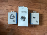 Action camera accessory bundle retail boxes: Hero 4K, head strap 2.0, hand & wrist strap