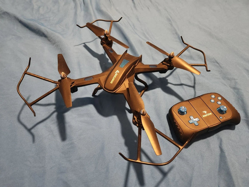 Brown camera drone with four propellers and matching brown handheld remote controller