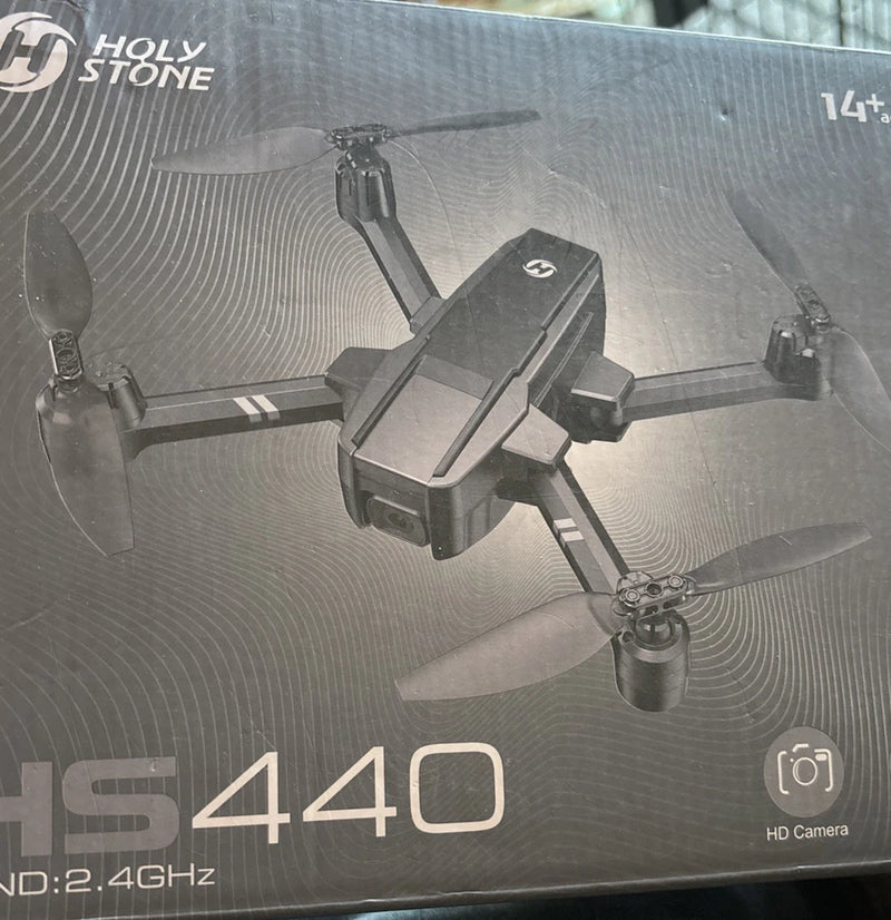 Holy Stone HS440 quadcopter drone with 4 propellers, shown on box