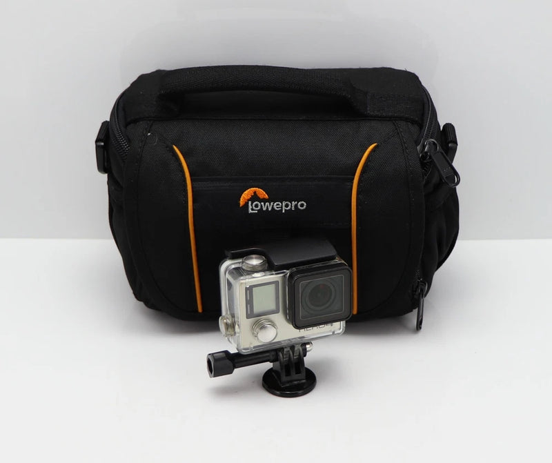 GoPro action camera in clear housing with small tripod mount, in black carry case