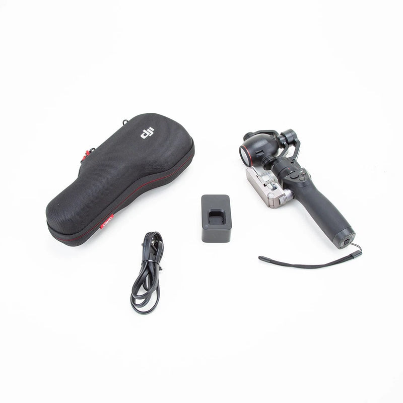 Handheld gimbal camera kit with carrying case, charging cable, and accessory battery