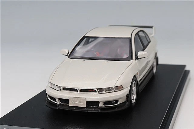 White 1:43 scale model car, front-left view with detailed headlights and grille.