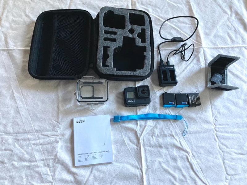 GoPro HERO8 black action camera bundle with waterproof case, mounts, and battery