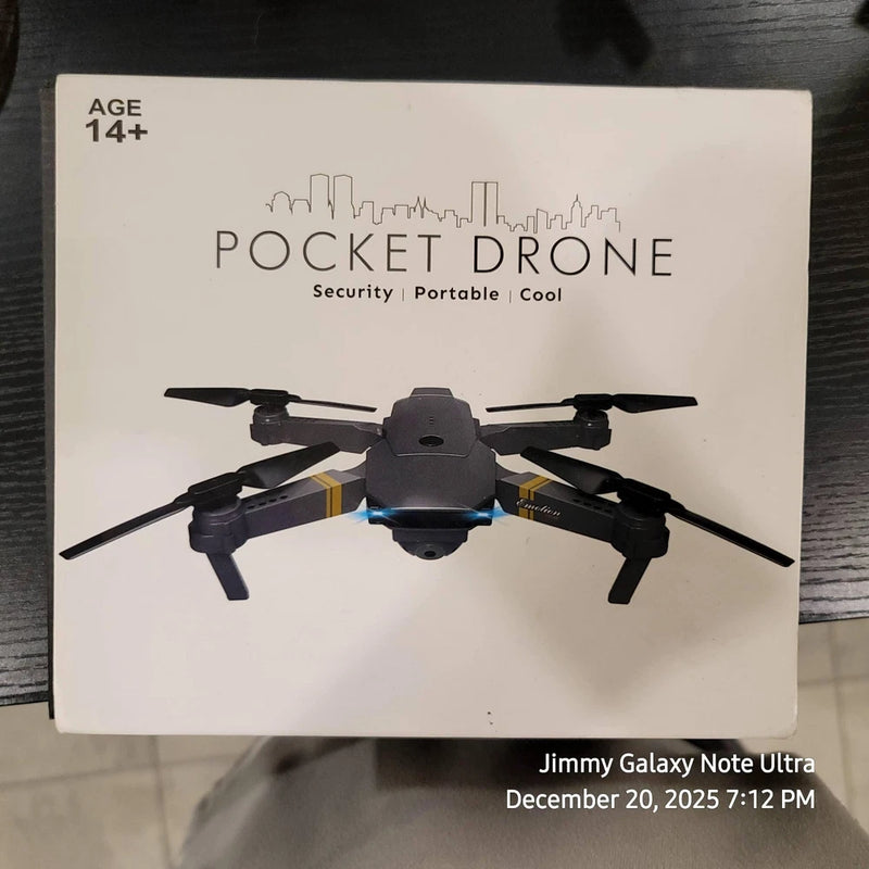 Black pocket drone with four propellers and centered camera, shown on product box