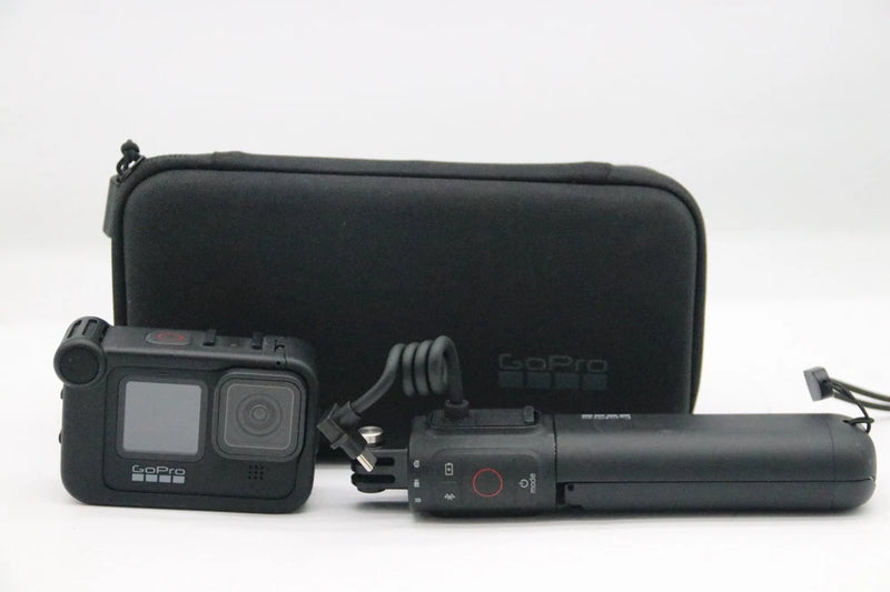 GoPro HERO 9 Black action camera with lens and black hard carrying case
