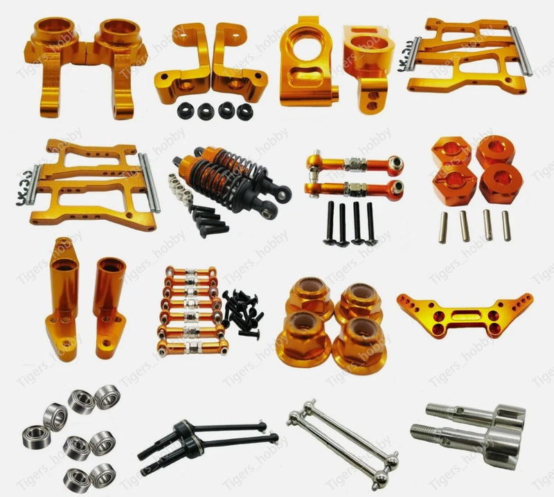 Orange aluminum CNC RC car upgrade parts set with brackets, hubs, bolts