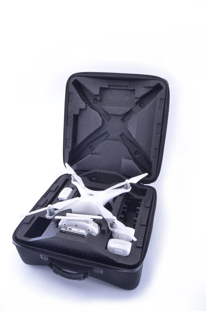 Inspak EVA hardshell backpack case, open with black foam insert and white drone inside
