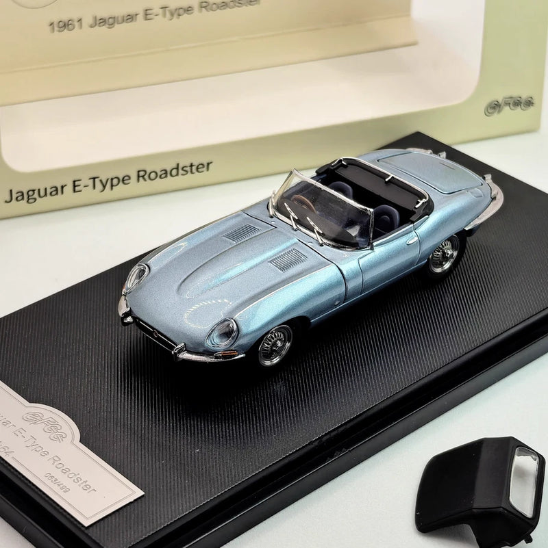 Ice blue Jaguar E-Type Roadster die-cast convertible model with open top, on display base