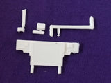 White plastic vehicle engine accessory with radiator housing and attached brackets