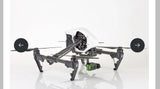 Drone with gimbal camera and quadcopter frame, black and gray with white body