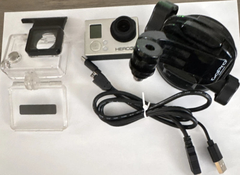 GoPro HERO3+ action camera with waterproof housing, mounts, and USB cables