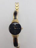 Two-tone women's wristwatch with gold case, black dial, and black-and-gold link band