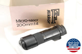 Micro-Nikkor 200mm f/4 telephoto lens with ridged focus ring, in retail box