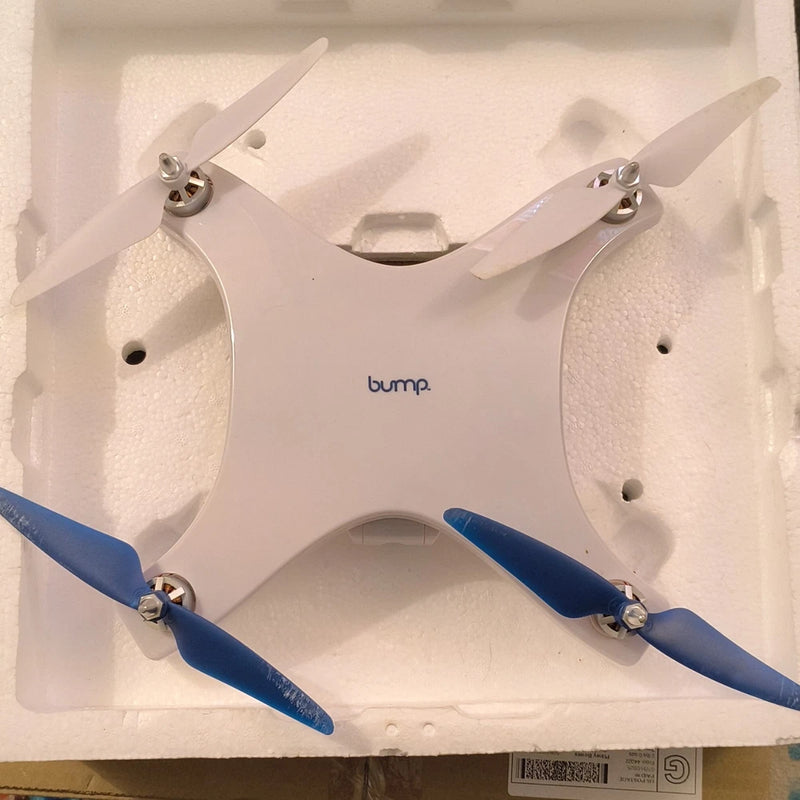 Bump drone with white body and four blue propellers